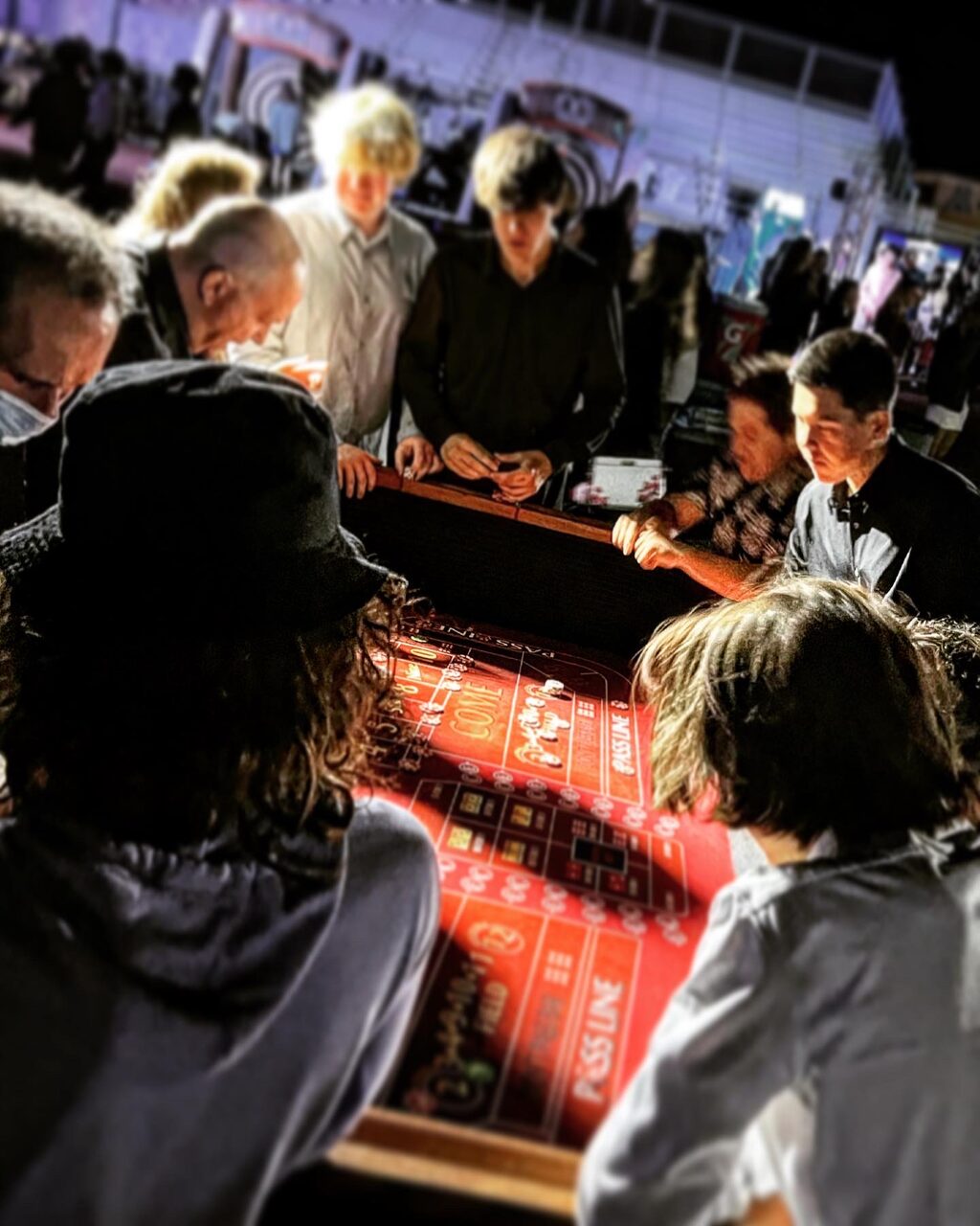 Lively craps table at a San Francisco rooftop casino party