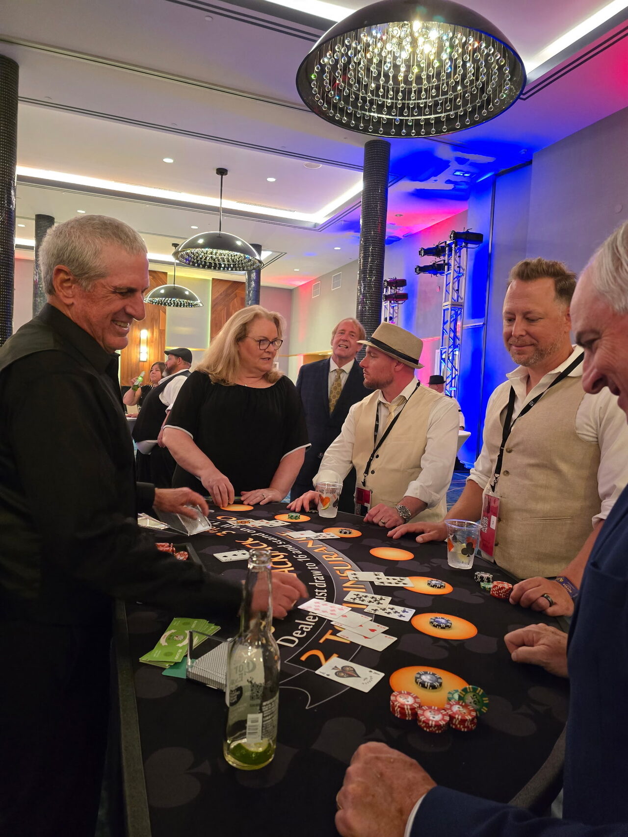 Guests playing blackjack at a San Francisco hotel ballroom casino party