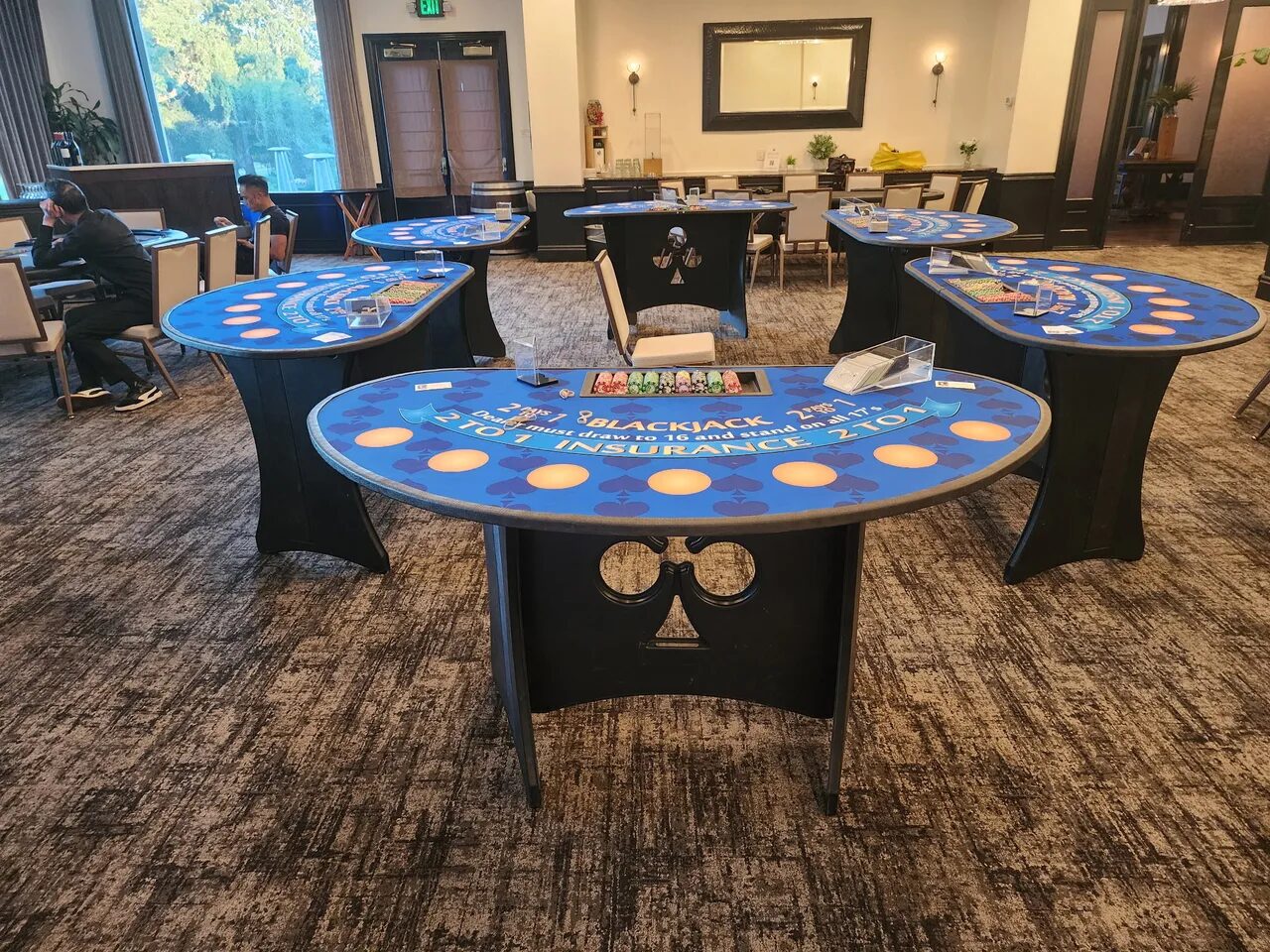 Rows of blackjack tables at a Bay Area fundraiser casino night