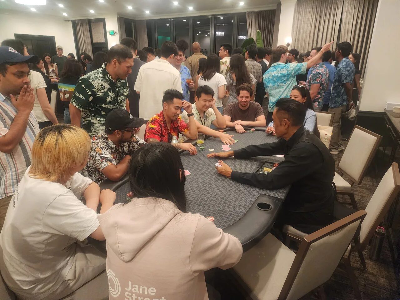 Players at a Texas Hold'em poker table during a San Francisco casino night